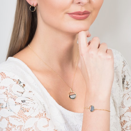 Bransoletka koło Savicki: srebrna pozłacana, onyks